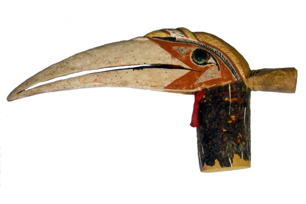 Malagan totem from New Ireland in the form of a carved hornbill head with Turbo petholatus opercula as eyes. Late 19th century. Used in Malagan ceremonies - 1981.1435 © McLean Museum and Art Gallery, Greenock.