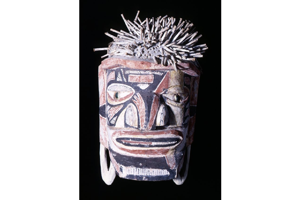 Malagan totem head from New Ireland decorated with various pigments, including lime, and the eyes made from Turbo petholatus opercula. Late 19th century - 1981.1437 © McLean Museum and Art Gallery, Greenock.