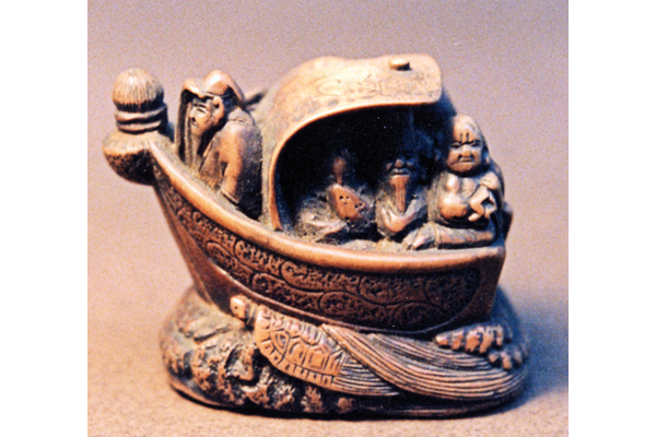 Japanese 18th century ivory netsuke in the form of a Takarabune or treasure ship of the Seven Gods of Happiness - 1981.28 - ©McLean Museum and Art Gallery, Greenock.