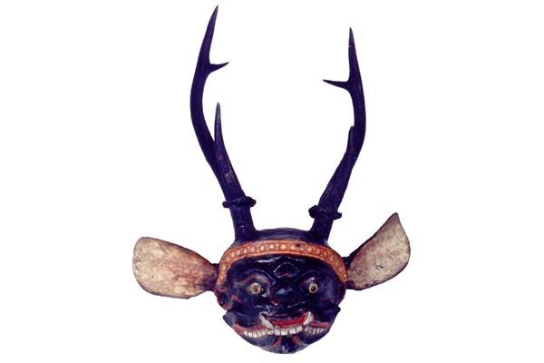 This spirit head is from Myanmar. It is 19th century in date and is based on a skull of a Sitka deer decorated with gesso, pigment and a pair of white metal ears. - 1981.447 - ©McLean Museum and Art Gallery, Greenock.