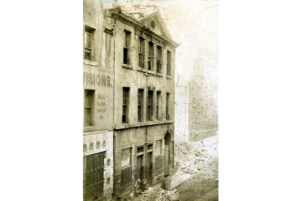 This view of the Anchor Inn shows the building from the south side. In the background right is the old Shaw Street School. - Bromide print on  paper - P4202 - © McLean Museum and Art Gallery, Greenock