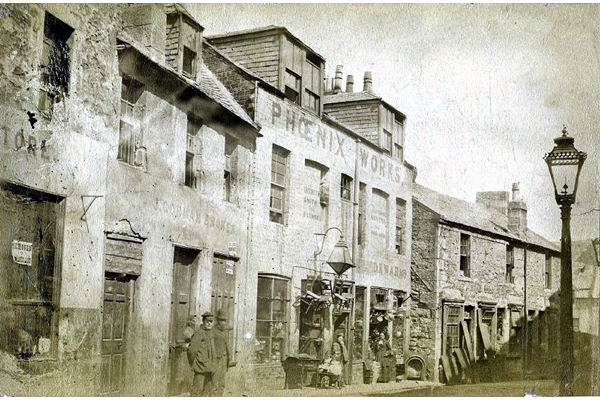 This view shows the east side of Taylor's Close with the Phoenix Works. It was probably taken around 1877 - Bromide print on paper - P4209 - © McLean Museum and Art Gallery, Greenock