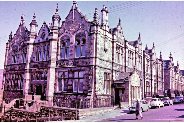 Holmscroft School, Greenock  - Colour transparency by Eugene Jean Méhat (1920-2000) photographed on the 29 March 1965 - 2008.72.140. Early instructions said that the children were to be encouraged in thrift, cleanliness and self-respect and that "all coarseness of language, deceit and cruelty should be specially reproved." - © McLean Museum and Art Gallery, Greenock.
