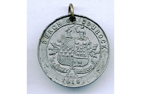 Burgh of Gourock peace medal inscribed on one face with 'Burgh of Gourock', the town coat of arms and the date, 1919. The reverse carries a kneeling figure offering an item to another with an angel in the background left with the sun above. - 2012.57.1