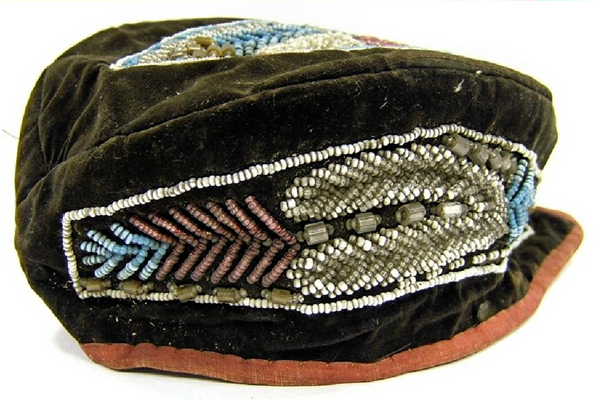 A 19th century Canadian First Nations hat made in a Glengarry style, covered with velvet and with a decoration of glass beads. This hat is in the style of the Haudenosaunee People and was probably made by them. - 1981.843 © McLean Museum and Art Gallery, Greenock.