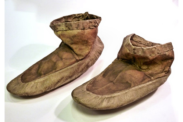 A pair of 19th century Inuit boots or shoes, period unknown,but made prior to 1877. They are constructed from sealskin and sewn together with seal gut. - 1981.864 © McLean Museum and Art Gallery, Greenock.