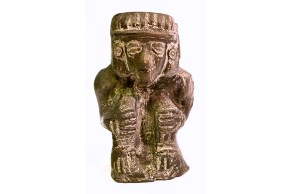 A black glazed ceramic figure sitting in a crouched position from Mexico, period unknown, possibly representing a god. - 1981.861 © McLean Museum and Art Gallery, Greenock.