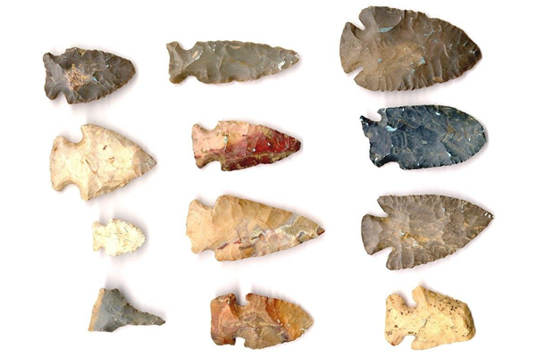 Twelve native American stone arrowheads of different shapes and sizes and in different flints and stones.The arrowheads were said by the donor to have come from 'an old Indian fort' at North Bend, Ohio. - 1998.78 © McLean Museum and Art Gallery, Greenock.