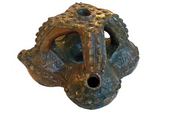 A 19th century clay water vessel or saqa moli from Fiji consisting of a cluster of four hollow, connected and communicating spheres glazed with kauri gum. -  1981.858 © McLean Museum and Art Gallery, Greenock.