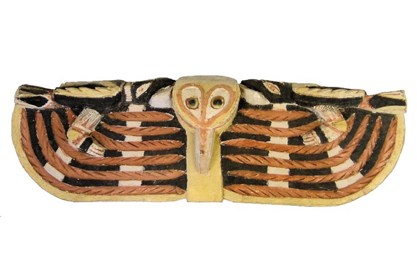 A late 19th century Malagan totem from New Ireland in the form of a carved figure of a bird with head and outstretched wings. The eyes of the bird are formed from Turbo petholatus opercula. - 1981.1439 © McLean Museum and Art Gallery, Greenock.