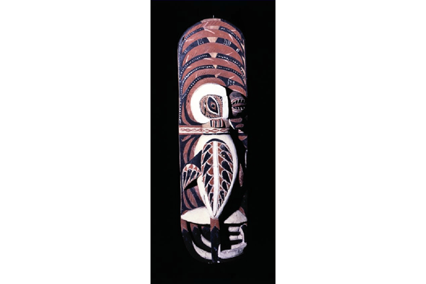 A late 19th century Malagan totem from New Ireland in the form of a wooden panel with bird facing right carved in high relief. The eye is made from the Turbo petholatus opercula. - 1981.1438 © McLean Museum and Art Gallery, Greenock.