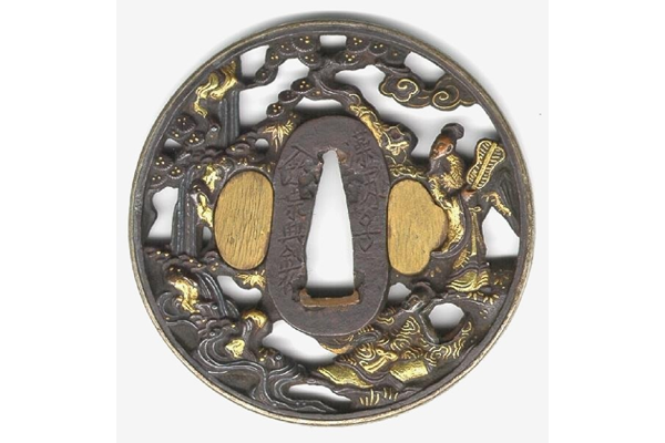 A Japanese swordguard or tsuba, date unknown. The design shows Soki and an attendant under a pine tree with a waterfall. Inscription on both sides. The rim of the tsuba is gilded. - 1981.1156 - © McLean Museum and Art Gallery, Greenock