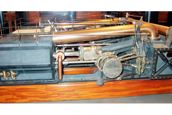 Model of a compound naval trunk engine made by Caird & Co., Greenock. The model is made of brass, iron and steel and probably dates from around 1860. - L1988.9  - © McLean Museum and Art Gallery, Greenock