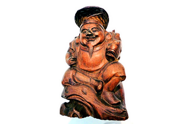 A nineteenth century carved wooden figure of the Japanese deity Ebisu. - 1981.162 - © McLean Museum and Art Gallery, Greenock