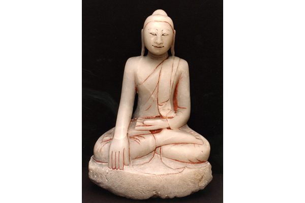 A carved marble seated figure of a Shakyamuni Buddha, probably 19th century, from Myanmar. The figure is seated in vajrasana, his right hand in bhumisparshamudra. - 1981.1244 - © McLean Museum and Art Gallery, Greenock