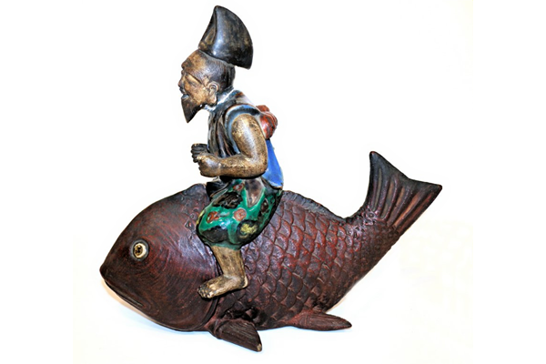 19th century ceramic and enamel figure of the god Ebisu riding the Red Tai fish. Made at Aivata near Kyoto by an unknown ceramicist. - 1981.1412 - © McLean Museum and Art Gallery, Greenock