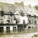 This view shows shops and houses in bad repair at the corner of Vennel and Dalrymple Street on the north side of Wallace Square, Greenock. - Photographed by Robert Urie - Bromide print on paper - P4211 - © McLean Museum and Art Gallery, Greenock