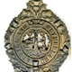 Cap badge of the Argyle & Sutherland Highlanders, the design was used from 1900 until 1959, but this example, according to the old label, is from the 2nd Battle of Ypres in  1915. - 1999.63.147 - © McLean Museum and Art Gallery, Greenock