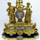 19th century gold painted cast iron presentation clock. The is inscribed: 'Presented to Mr. Thomas D. Rorison (along with a gem ring to Mrs Rorison) by the employees of Messrs. Crawhall Allison & Co. Sugar Refinery as a token of esteem, on the occasion of his leaving the works to occupy a better position. Greenock 14th July 1877'.  - 1998.11 ©McLean Museum and Art Gallery, Greenock.