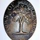 An official Burgh of Greenock Beggar's Badge, dated 1797-1803, issued to official beggar no.50. The badge is decorated with an image of an oak tree and inscribed 'Town of Greenock 50'. - 1977.284 - © McLean Museum and Art Gallery, Greenock