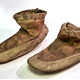 A pair of 19th century Inuit boots or shoes, period unknown,but made prior to 1877. They are constructed from sealskin and sewn together with seal gut. - 1981.864 © McLean Museum and Art Gallery, Greenock.