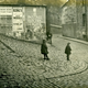 The upper part of Chapel Lane, Port Glasgow in the 1920s with children playing and a cobbled lane. - 2009.98.10 - © McLean Museum and Art Gallery, Greenock