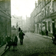 Chapel Lane, Port Glasgow with crowds on foot and a motor car. - 2009.98.13 - © McLean Museum and Art Gallery, Greenock.