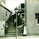 Women and children standing at the entrance to the houses at 19 Balfour Street, Port Glasgow. - 2009.98.35 - © McLean Museum and Art Gallery, Greenock